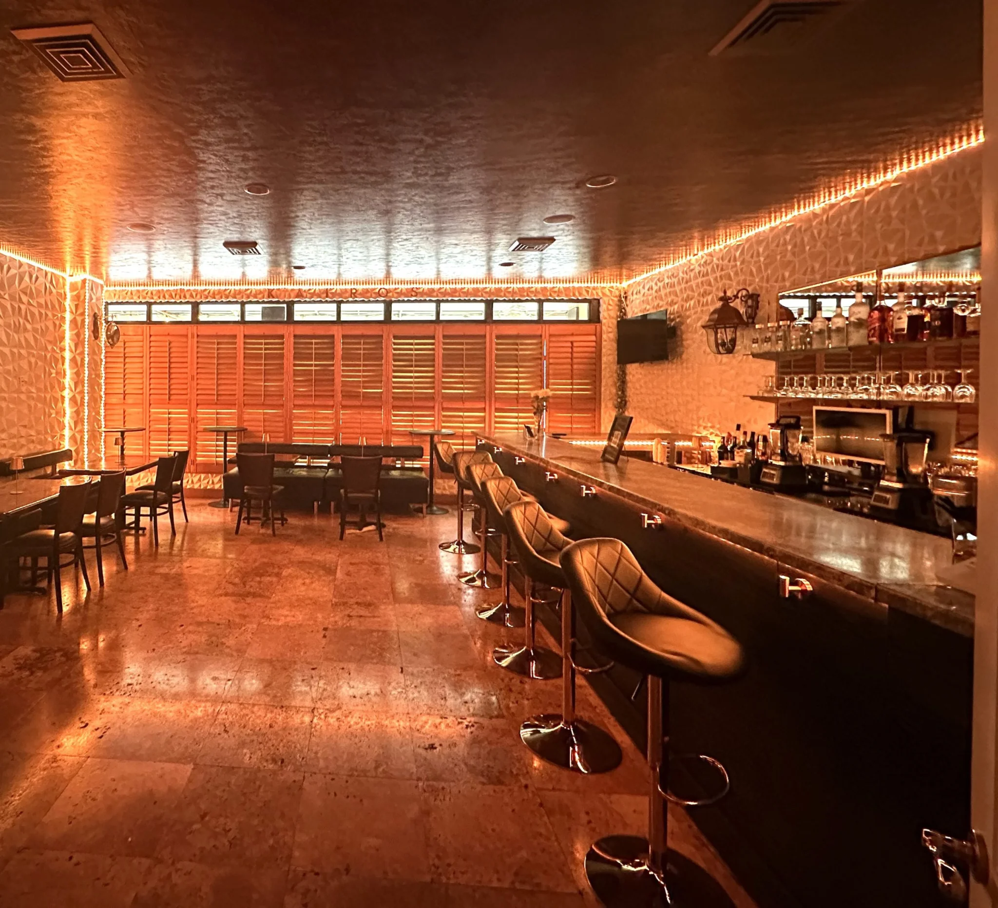 Lucent Lounge bar at Kairos with modern lighting and private seating